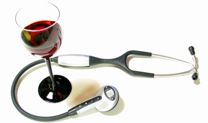 A glass of red wine with a stethoscope
