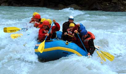 Adventure-lovers enjoying a whitewater rafting trip