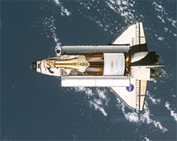 The Space Shuttle Discovery orbiting Earth, with a payload of Schramsberg sparkling wine