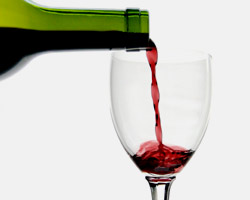 Red wine poured into a glass