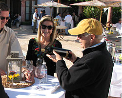 George Rosenthal Pours a Glass of Wine at the Rosenthal-The Malibu Estate 20th Anniversary Party