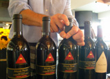 Opening bottles of red wine for a tasting